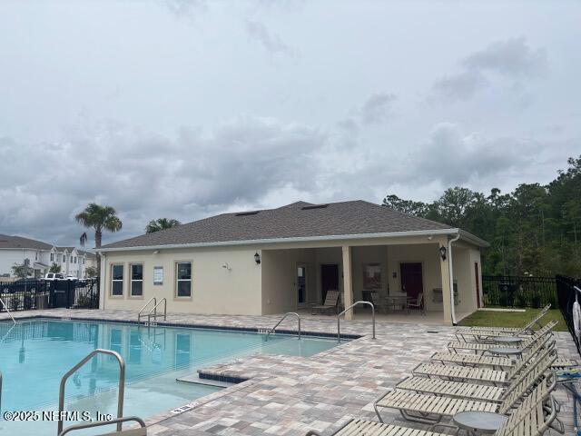 172 Reena Dr, Daytona Beach, FL 32117 - community pool with a patio area and fence
