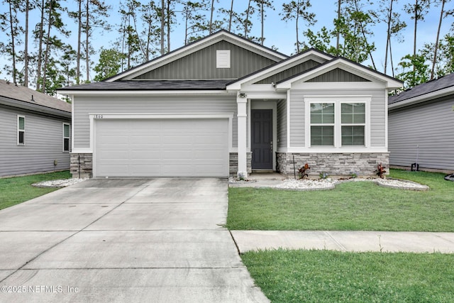1860 Cogdill, Middleburg, FL 32068 - view of front of home with stone siding, board and batten siding, concrete driveway, and an attached garage