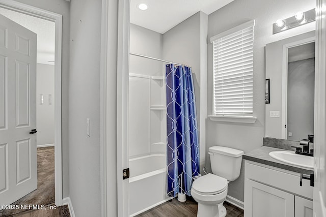 1860 Cogdill, Middleburg, FL 32068 - bathroom featuring toilet, vanity, shower / bathtub combination with curtain, wood finished floors, and baseboards