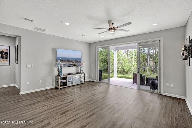 1860 Cogdill, Middleburg, FL 32068 - unfurnished living room featuring ceiling fan, wood finished floors, baseboards, and recessed lighting