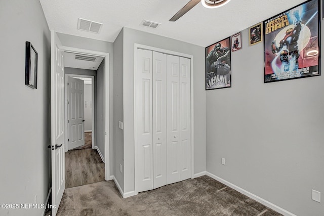 1860 Cogdill, Middleburg, FL 32068 - unfurnished bedroom with a closet, carpet floors, baseboards, and ceiling fan