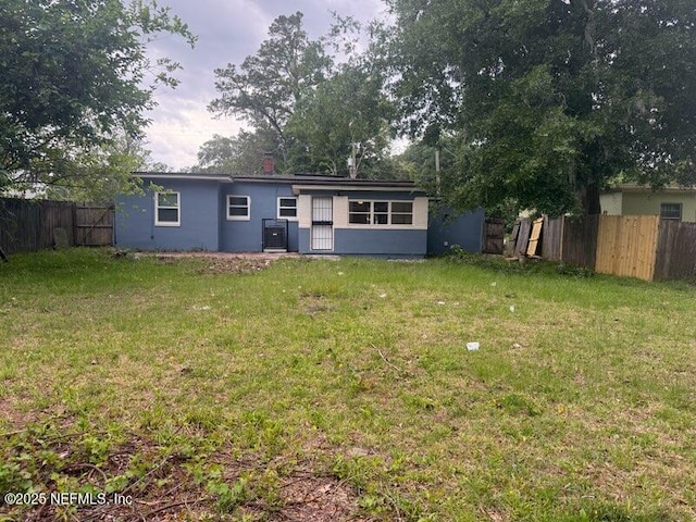 7205 Linda Dr, Jacksonville, FL 32208 - back of house with stucco siding