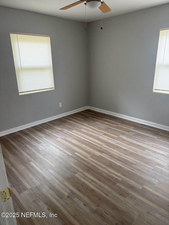 7205 Linda Dr, Jacksonville, FL 32208 - empty room with a ceiling fan, wood finished floors, and baseboards
