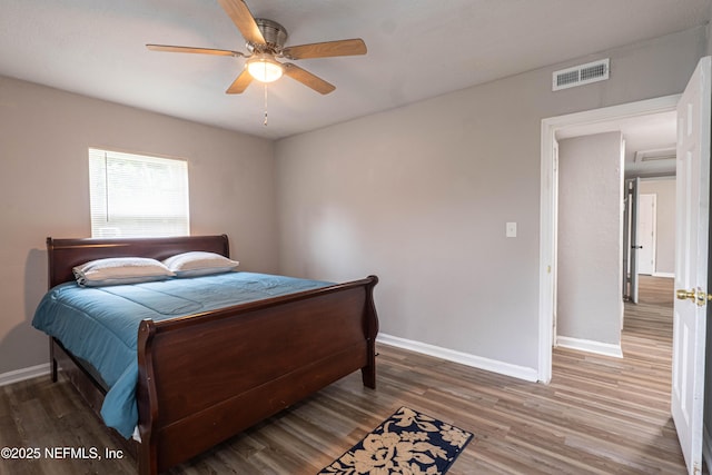 7205 Linda Dr, Jacksonville, FL 32208 - bedroom featuring baseboards, wood finished floors, and ceiling fan
