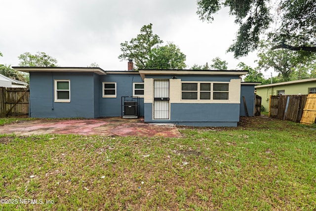 7205 Linda Dr, Jacksonville, FL 32208 - back of house featuring a chimney