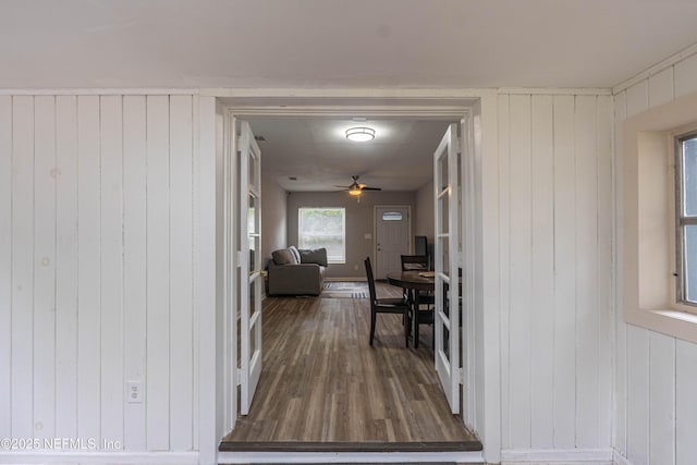 7205 Linda Dr, Jacksonville, FL 32208 - corridor with dark wood-type flooring and wooden walls