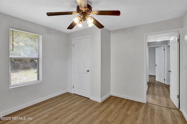 1021 Seminole Ave, Jacksonville, FL 32254 - unfurnished bedroom featuring light wood-style floors, multiple windows, and baseboards