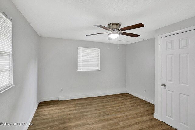 1021 Seminole Ave, Jacksonville, FL 32254 - unfurnished room with ceiling fan, wood finished floors, plenty of natural light, and baseboards