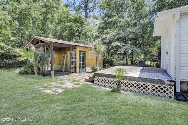 1021 Seminole Ave, Jacksonville, FL 32254 - view of green lawn featuring a deck and an outbuilding