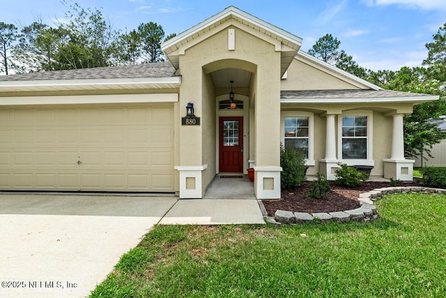 880 W American Eagle Dr, Saint Augustine, FL 32092 - view of front of property with stucco siding, driveway, an attached garage, a front yard, and a shingled roof