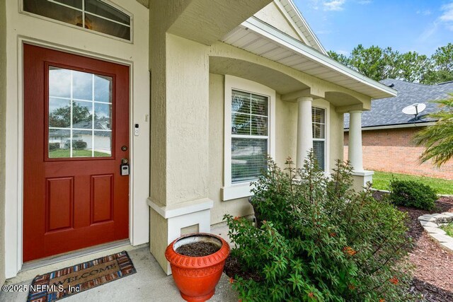 880 W American Eagle Dr, Saint Augustine, FL 32092 - view of exterior entry with stucco siding
