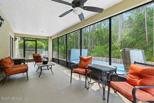 880 W American Eagle Dr, Saint Augustine, FL 32092 - sunroom featuring a ceiling fan and a forest view