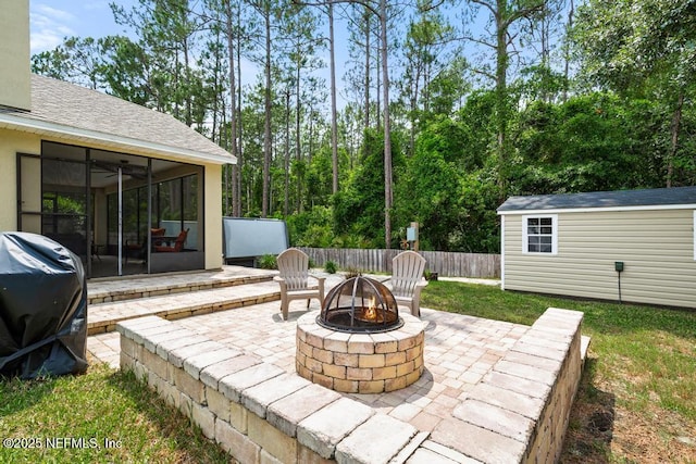 880 W American Eagle Dr, Saint Augustine, FL 32092 - view of patio / terrace with a fire pit, a sunroom, a grill, and ceiling fan