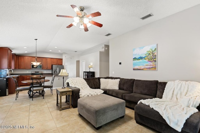 880 W American Eagle Dr, Saint Augustine, FL 32092 - living room with light tile patterned floors, lofted ceiling, ceiling fan, recessed lighting, and a textured ceiling