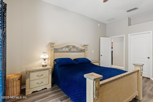 880 W American Eagle Dr, Saint Augustine, FL 32092 - bedroom featuring wood finished floors and a textured ceiling