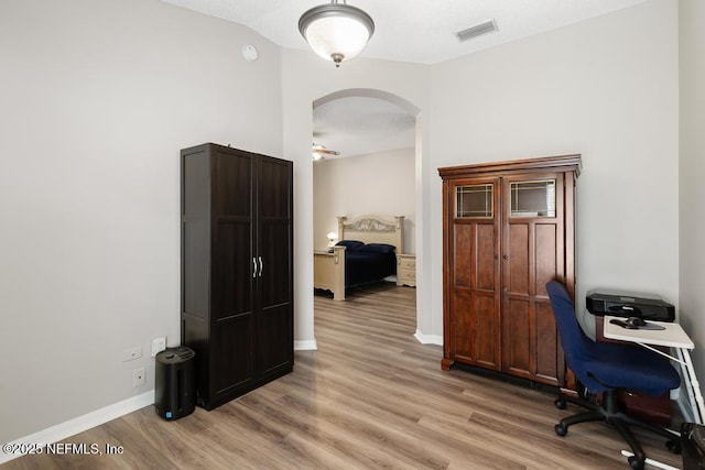 880 W American Eagle Dr, Saint Augustine, FL 32092 - office space with arched walkways, light wood-style floors, baseboards, and ceiling fan