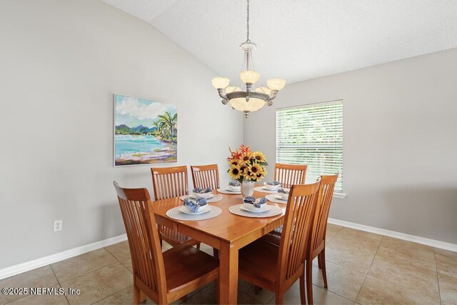 880 W American Eagle Dr, Saint Augustine, FL 32092 - dining space with lofted ceiling, a chandelier, baseboards, and light tile patterned flooring