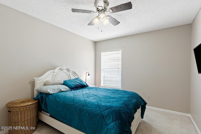 880 W American Eagle Dr, Saint Augustine, FL 32092 - carpeted bedroom featuring a textured ceiling, a ceiling fan, and baseboards