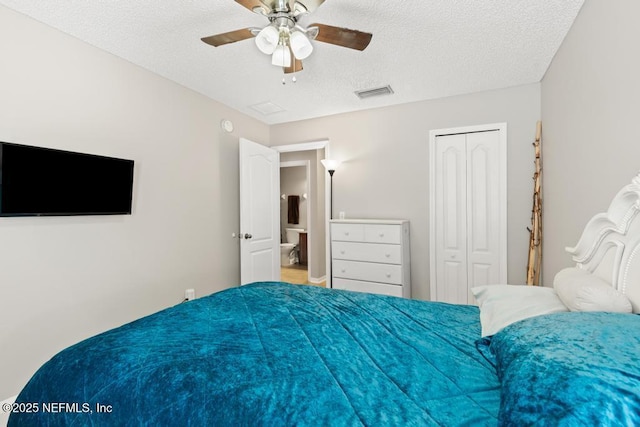 880 W American Eagle Dr, Saint Augustine, FL 32092 - bedroom featuring a textured ceiling, a closet, and a ceiling fan