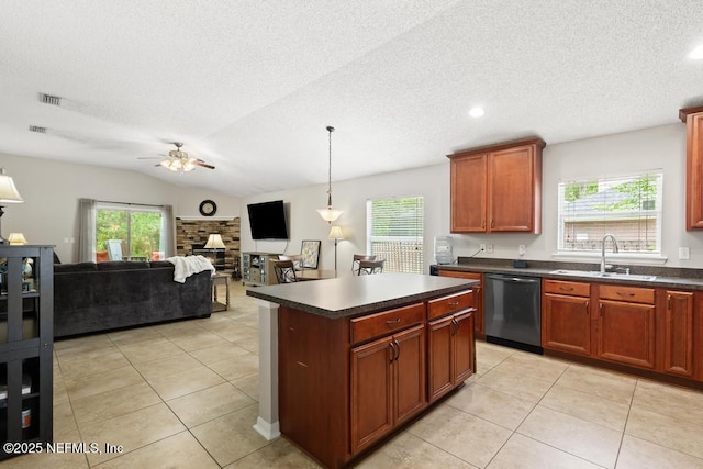 880 W American Eagle Dr, Saint Augustine, FL 32092 - kitchen with dishwasher, a sink, dark countertops, healthy amount of natural light, and a textured ceiling