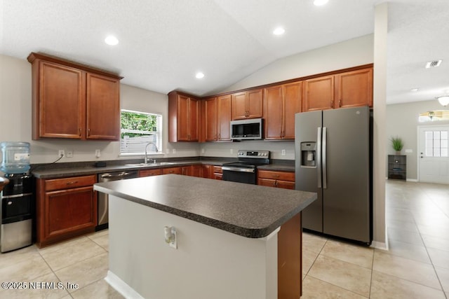 880 W American Eagle Dr, Saint Augustine, FL 32092 - kitchen featuring stainless steel appliances, dark countertops, a sink, healthy amount of natural light, and recessed lighting
