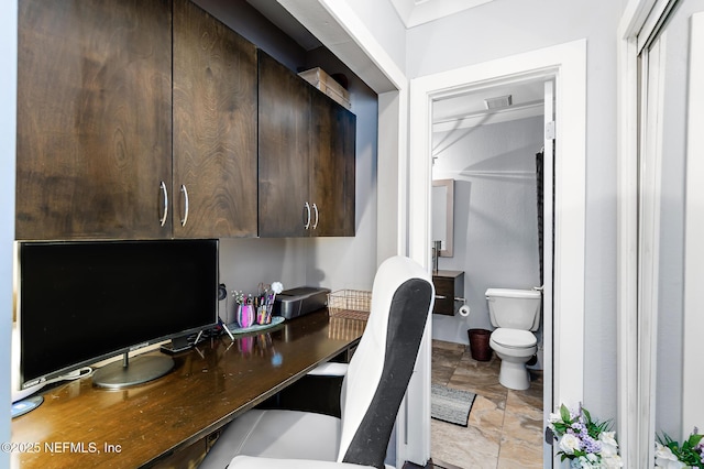 home office featuring stone finish flooring