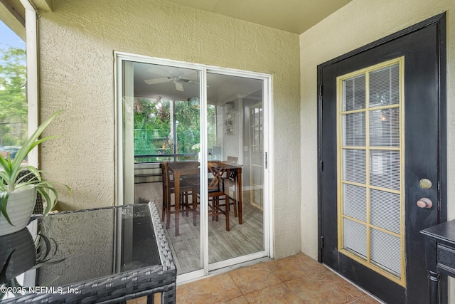 view of exterior entry with stucco siding