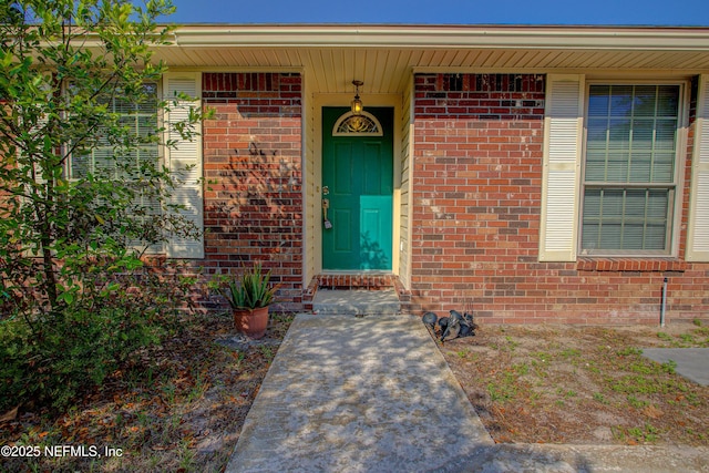 entrance to property with brick siding