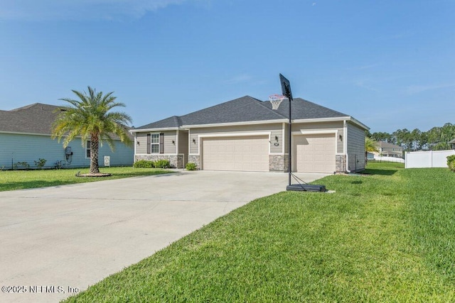 567 Flach Dr, Saint Johns, FL 32259 - view of front of home featuring a garage, concrete driveway, and stone siding