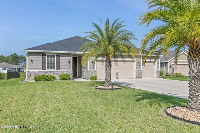 567 Flach Dr, Saint Johns, FL 32259 - view of front of house featuring stone siding, concrete driveway, and a garage