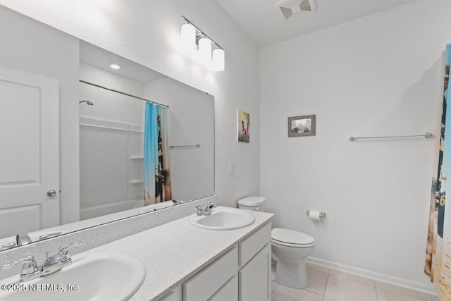 567 Flach Dr, Saint Johns, FL 32259 - bathroom featuring double vanity, tile patterned flooring, toilet, baseboards, and shower / tub combo