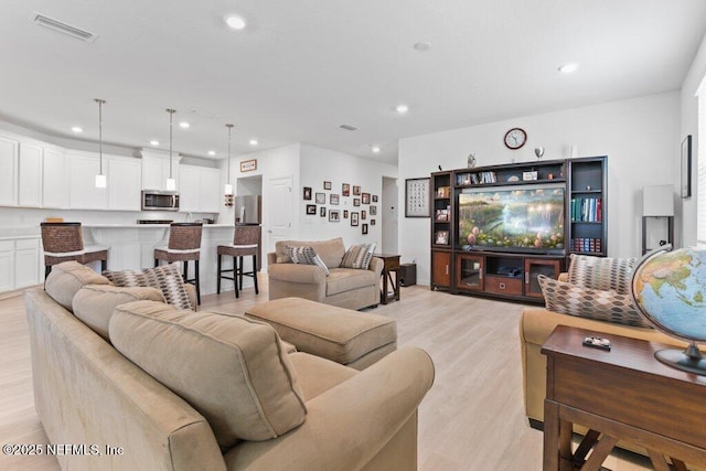 567 Flach Dr, Saint Johns, FL 32259 - living room with light wood-style floors and recessed lighting