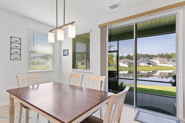 567 Flach Dr, Saint Johns, FL 32259 - dining space featuring a water view and light wood-style flooring