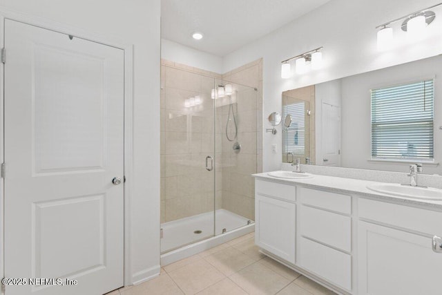 567 Flach Dr, Saint Johns, FL 32259 - bathroom featuring tile patterned flooring, a stall shower, and double vanity