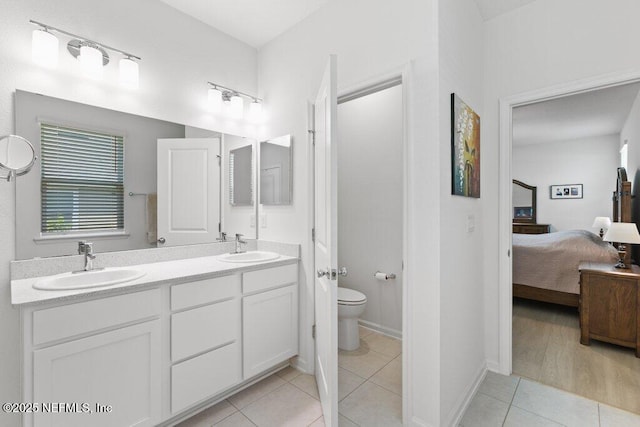 567 Flach Dr, Saint Johns, FL 32259 - full bathroom featuring ensuite bathroom, tile patterned floors, double vanity, and toilet