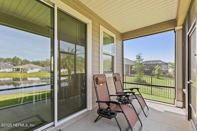 567 Flach Dr, Saint Johns, FL 32259 - sunroom / solarium featuring a water view, carpet flooring, and a residential view