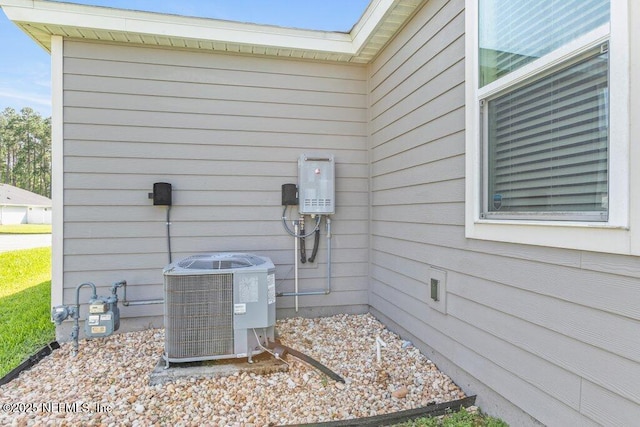 567 Flach Dr, Saint Johns, FL 32259 - exterior view of central air condition unit, gas meter, and a skylight