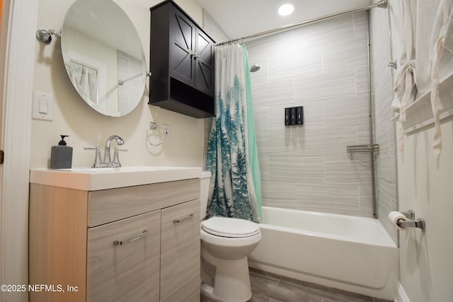 bathroom with toilet, shower / tub combo, vanity, and wood finished floors