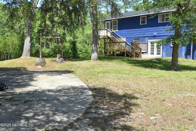 2873 Creek St, Middleburg, FL 32068 - view of green lawn featuring stairway, french doors, and a deck