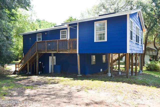 2873 Creek St, Middleburg, FL 32068 - rear view of house with stairway, a wooden deck, and a carport