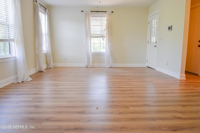2873 Creek St, Middleburg, FL 32068 - unfurnished room featuring plenty of natural light, light wood-style flooring, and baseboards