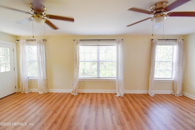 2873 Creek St, Middleburg, FL 32068 - spare room featuring a ceiling fan, light wood-type flooring, and baseboards
