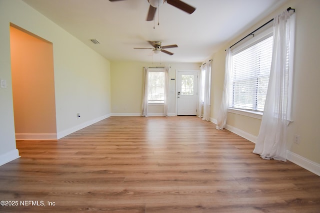 2873 Creek St, Middleburg, FL 32068 - empty room with a ceiling fan, light wood-style flooring, and baseboards