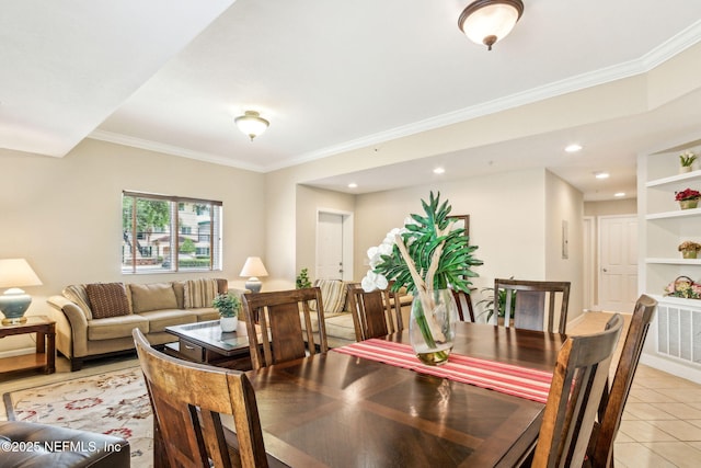 dining space with ornamental molding, light tile patterned flooring, and recessed lighting