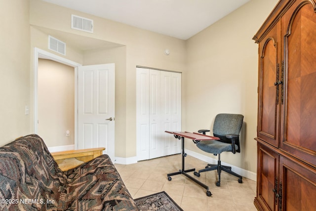 home office featuring light tile patterned floors and baseboards