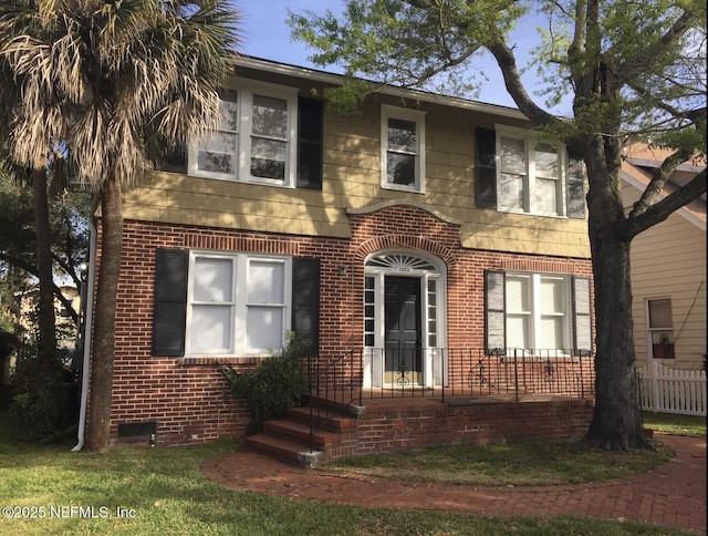 2523 Forbes St, Jacksonville, FL 32204 - view of front of house with brick siding and fence
