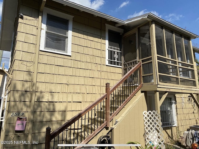 2523 Forbes St, Jacksonville, FL 32204 - view of home's exterior featuring stairs and a sunroom