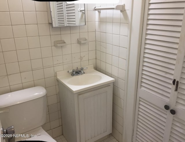 2523 Forbes St, Jacksonville, FL 32204 - bathroom with tile walls, vanity, and toilet