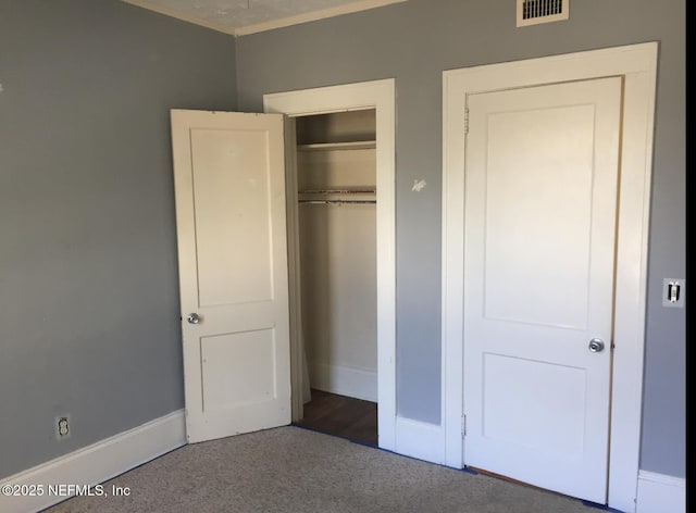 2523 Forbes St, Jacksonville, FL 32204 - unfurnished bedroom with carpet, a closet, baseboards, and ornamental molding