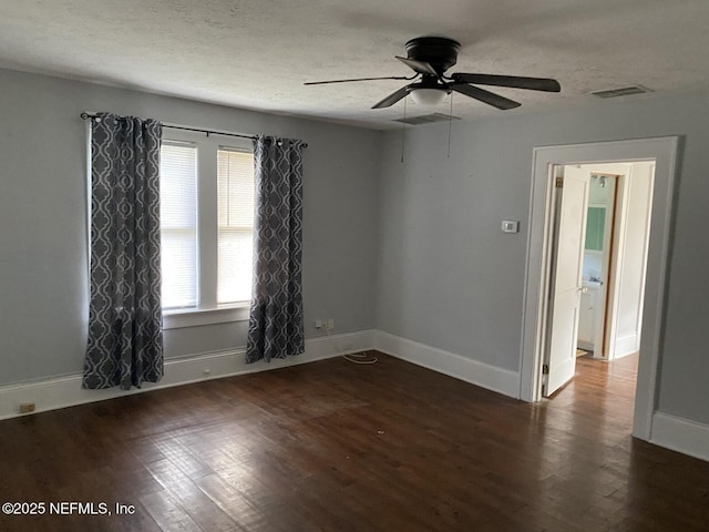 2523 Forbes St, Jacksonville, FL 32204 - unfurnished room with ceiling fan, wood finished floors, a textured ceiling, and baseboards